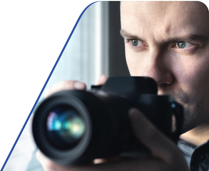 Amtivo (Formerly Certification Europe and EQA) - Private Investigator Certification - Close-up of a investigator holding a camera