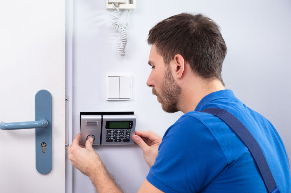 Amtivo (Formerly Certification Europe and EQA) Worker installing access control panel